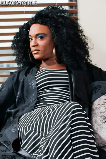 Thick Ebony Trans Woman in Stockings Strips Nude and Poses Her Ass