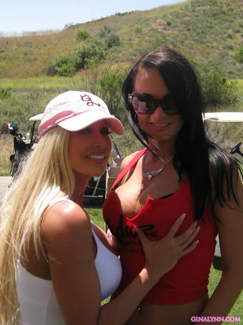 Gina Lynn: Tall Blonde Asian MILF Poses in a Skirt at Public Show – photo 8 of 15