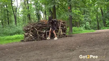 Brunette Spreads Her Shaved Pussy and Pees in the Forest