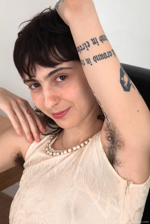 Thick Brunette Displays Her Hairy Underarms and Pussy – photo 1 of 16