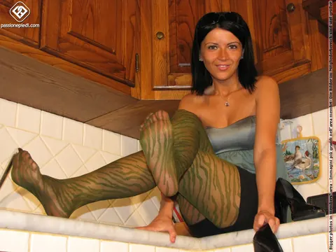 Brunette Poses in Shorts and Pantyhose in the Kitchen – photo 6 of 10