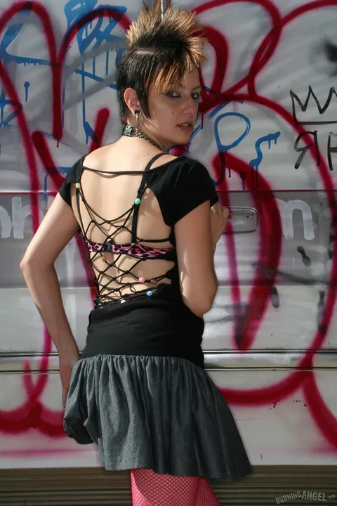 Short-Haired Woman Pulls Down Her Fishnets and Spreads Outdoors – photo 4 of 17