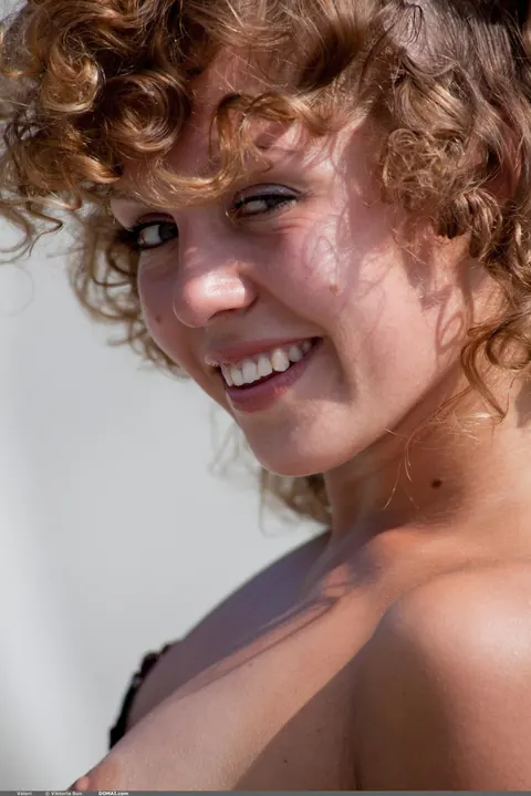 Curly Redhead in a Bikini and Heels Strips Outdoors – photo 2 of 21