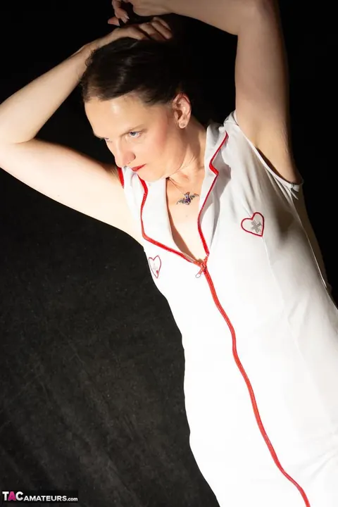 Thick Mature Nurse Lifts Her Skirt and Uses a Strap-On – photo 2 of 16