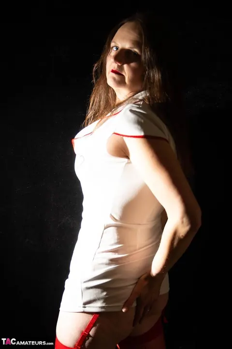 Thick Mature Nurse Lifts Her Skirt and Uses a Strap-On – photo 5 of 16