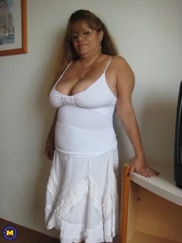 Mature Spanish Woman Strips Nude and Uses a Dildo