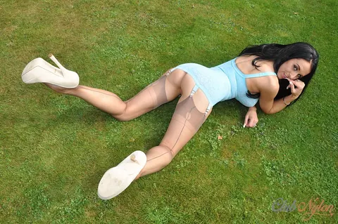 Louise Jenson: Busty Brunette MILF Flashes Lingerie and Stockings on the Lawn – photo 7 of 15