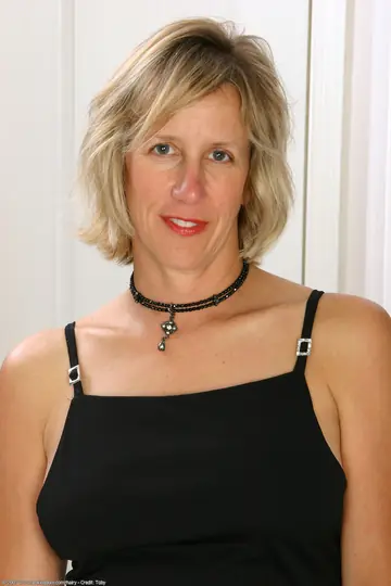 Mature Blonde in a Dress Strips to Show Her Hairy Pussy