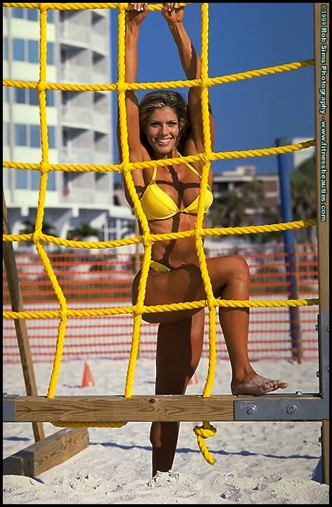 Torrie Wilson: Blonde MILF Poses in a Bikini on the Beach – photo 10 of 15