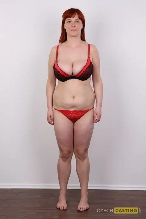 Curvy European Redhead Strips Naked by the Wall – photo 7 of 20