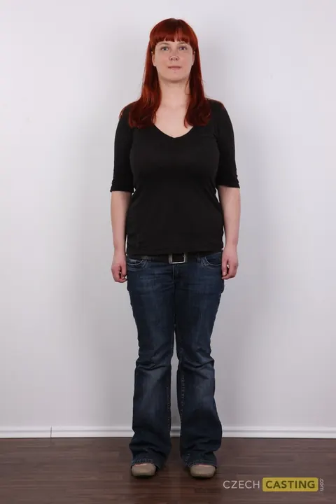 Curvy European Redhead Strips Naked by the Wall – photo 2 of 20