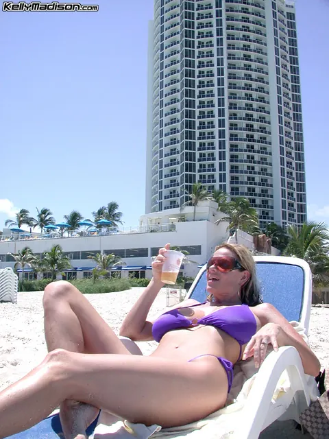 Kelly Madison: Blonde MILF in Glasses Sucks Strapon Outdoors in a Bikini – photo 8 of 16