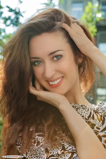 Brunette Stands Nude and Turns to Show Her Body