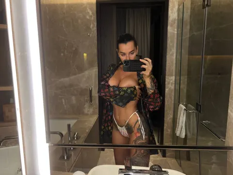 Short-Haired Brunette Flaunts Her Big Tits in Panties at the Mirror – photo 2 of 10