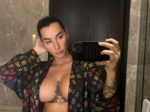 Short-Haired Brunette Flaunts Her Big Tits in Panties at the Mirror – photo 8 of 10