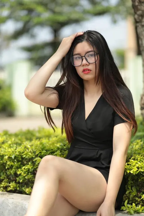 Petite Asian Brunette in Glasses Poses Outdoors in a Dress – photo 10 of 21