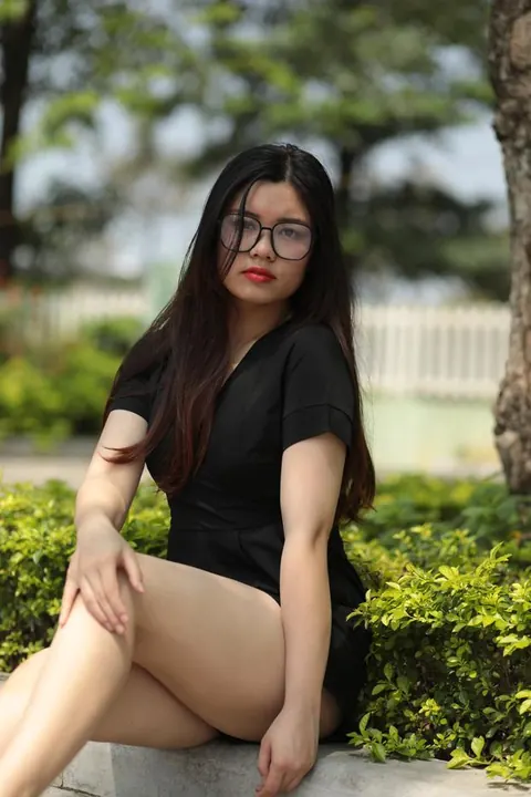 Petite Asian Brunette in Glasses Poses Outdoors in a Dress – photo 11 of 21