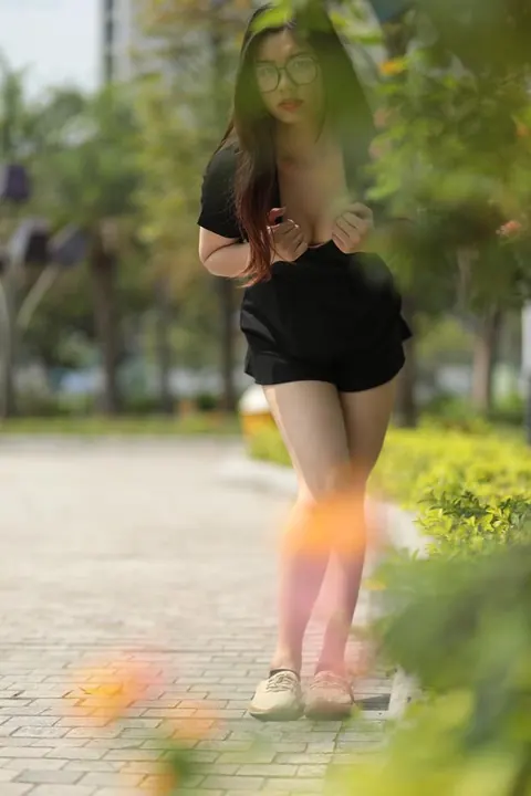 Petite Asian Brunette in Glasses Poses Outdoors in a Dress – photo 14 of 21