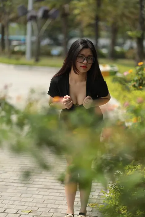 Petite Asian Brunette in Glasses Poses Outdoors in a Dress – photo 19 of 21