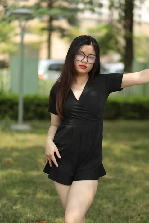 Petite Asian Brunette in Glasses Poses Outdoors in a Dress – photo 8 of 21