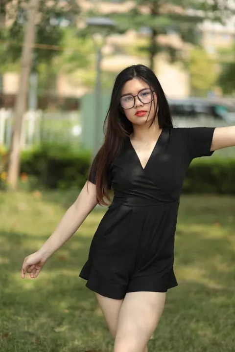 Petite Asian Brunette in Glasses Poses Outdoors in a Dress – photo 7 of 21