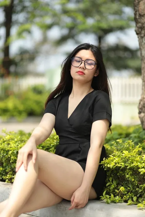 Petite Asian Brunette in Glasses Poses Outdoors in a Dress – photo 12 of 21