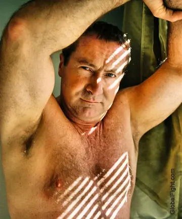 Hairy Mature Man Strips Nude and Poses