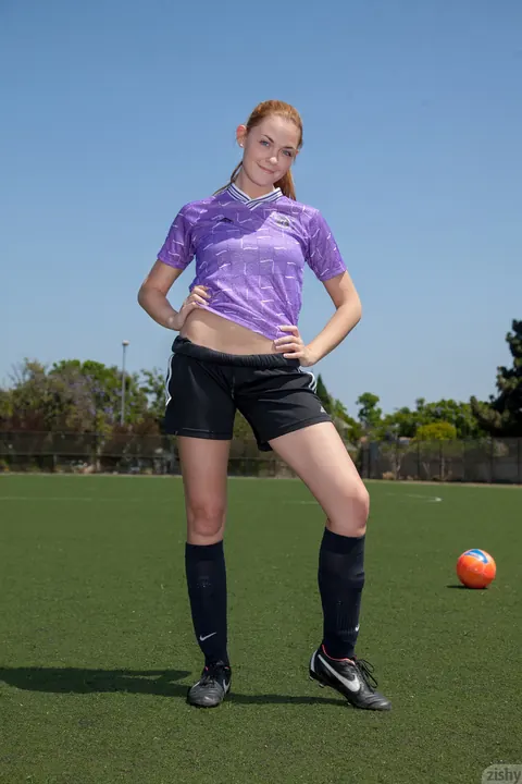 Bailey Rayne: Redhead Pulls Down Her Shorts to Flash Her Ass on a Soccer Field – photo 1 of 11