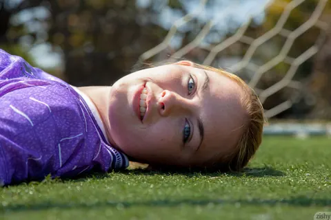 Bailey Rayne: Redhead Pulls Down Her Shorts to Flash Her Ass on a Soccer Field – photo 8 of 11
