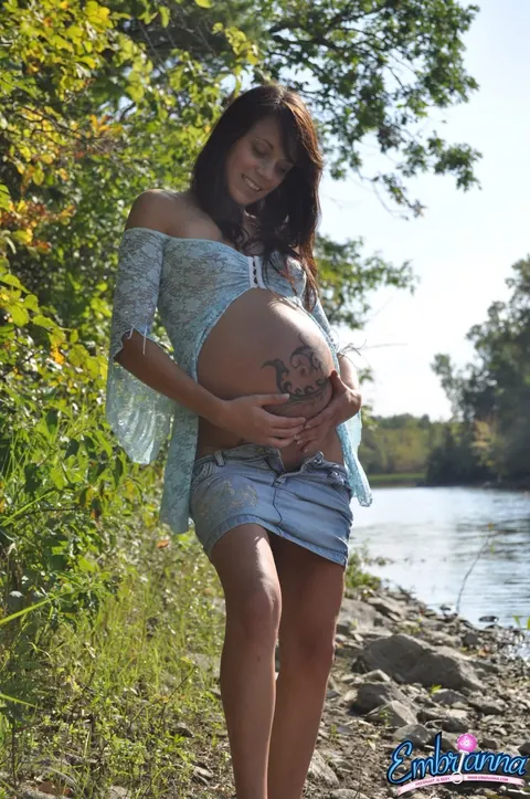 Pregnant Brunette Shows Her Belly and Ass on a River Beach – photo 5 of 15
