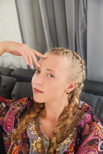 Ukrainian Blonde Undresses and Poses Nude on Camera