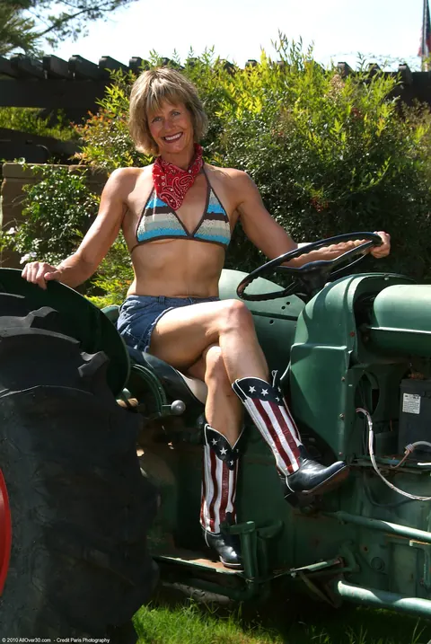 Short-Haired MILF Strips Out of Her Bikini on a Tractor – photo 3 of 21