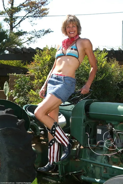 Short-Haired MILF Strips Out of Her Bikini on a Tractor – photo 4 of 21