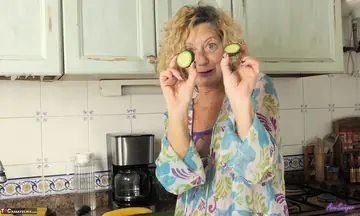 Mature European Blonde Strips and Masturbates with a Cucumber in the Kitchen
