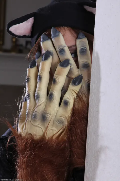 Jay Dee: Redhead MILF Peels Off Her Costume and Fingers Her Hairy Pussy – photo 1 of 21