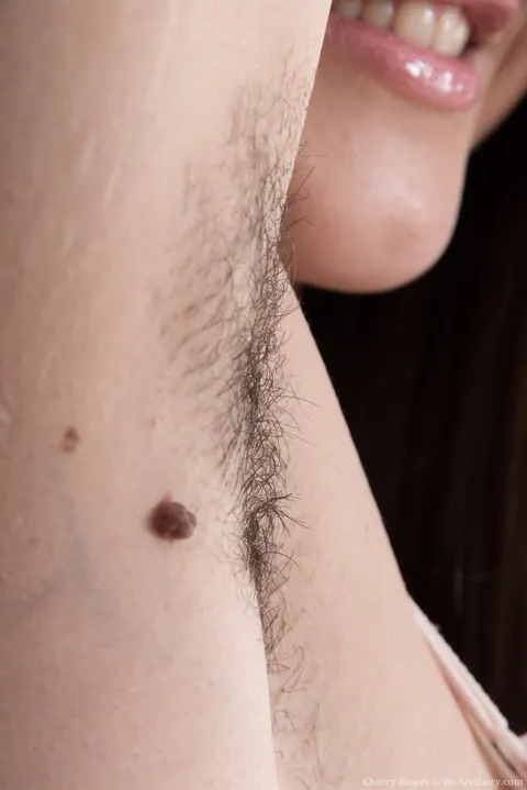 Cherry Bloom: Busty Brunette in Lingerie Pulls Aside Her Panties and Spreads Her Hairy Pussy – photo 7 of 16