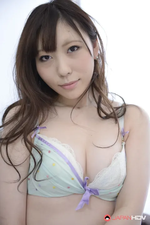 Japanese Brunette Goes Topless and Poses on the Sofa – photo 6 of 15