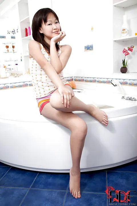 Petite Asian Woman Spreads Her Legs in the Bathroom – photo 3 of 16