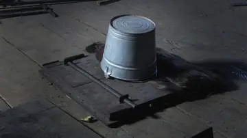 Busty Brunette Spreads and Takes a Dildo Anally in a Dungeon