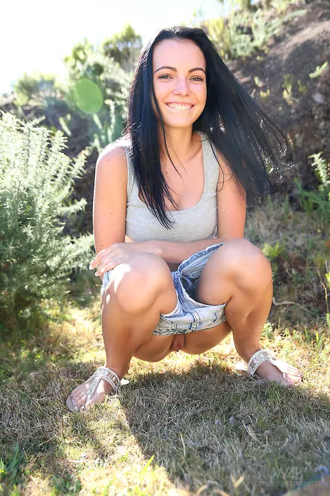 Sapphira A: Skinny Brunette Pisses and Spreads Her Pussy Outdoors – photo 2 of 16