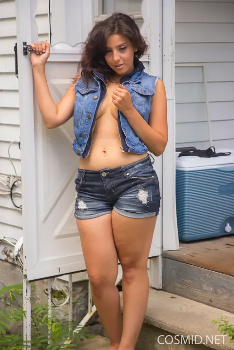 Brunette in Shorts Reveals Her Big Tits and Shows Her Ass Outdoors – photo 12 of 16