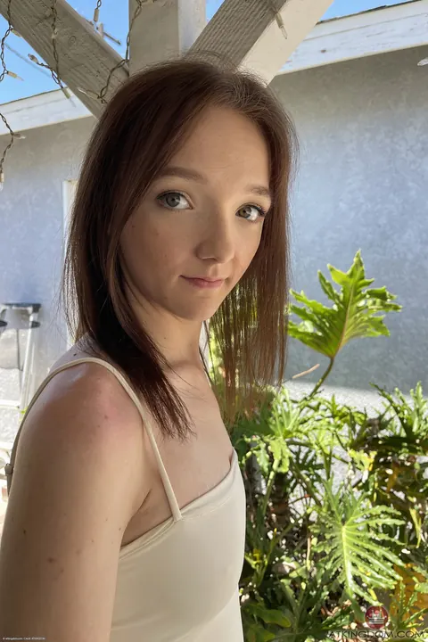 Woman Strips Nude and Poses Standing – photo 1 of 21