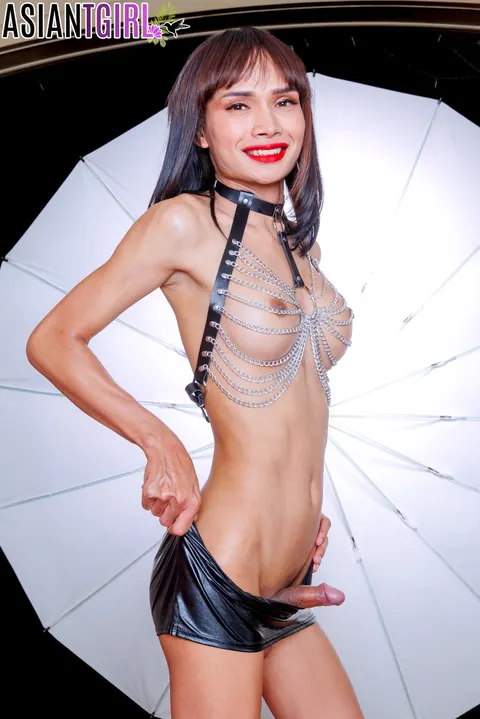 Asian Trans Woman Stands Nude and Poses with Leg Raised – photo 7 of 16