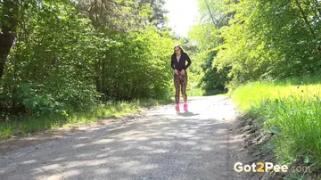 Busty Czech Redhead Spreads and Pisses on a Paved Road