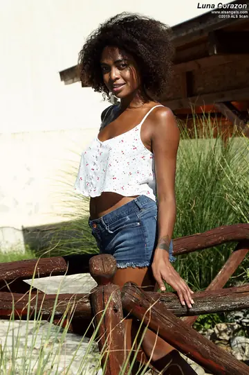 Ebony Babe Takes a Strap-On from Her Lesbian Lover in the Garden