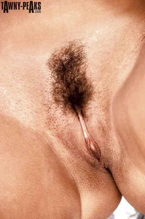 Tawny Peaks: Mature Curly Brunette Releases Her Big Enhanced Tits from Her Bikini – photo 12 of 16