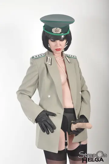 Short-Haired Brunette Strips Off Her Uniform and Uses a Strap-On Toy