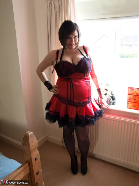 Roxy Anderson: Busty British MILF in a Dress and Stockings Fingers Herself – photo 1 of 16