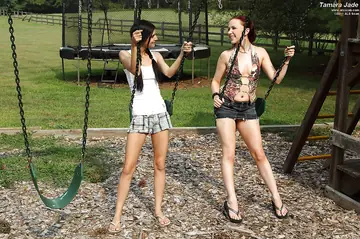 Elle Alexandra – Thick Brunette and Redhead Share Anal Dildo at the Playground