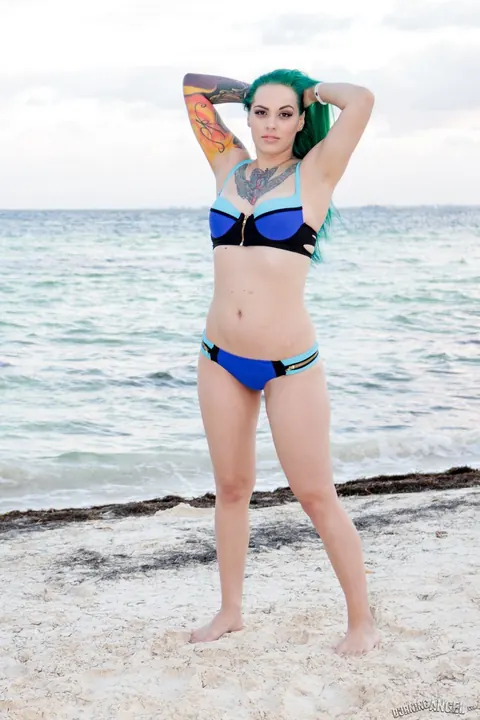 Taurus Angel: Short-Haired Woman in a Bikini Bares Her Ass on the Beach – photo 3 of 17